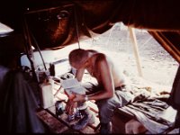 Sgt Maidai, my Recon Sgt, sitting on his designer cot in our luxurious quarters.